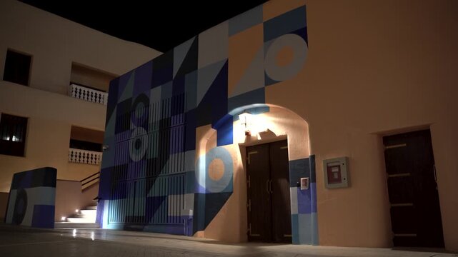 Building facade with geometric art projection mapping