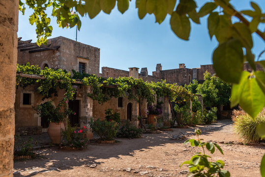 Arkadi, Greece - October 03, 2026 - Leaf Framed View of Traditional Monks Living Quarters at Arkadi Monastery