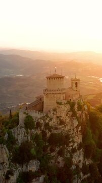 Flying over the amazing hilltop fortresses on Monte Titano in San Marino. San Marino one of the smallest countries in the world. Vertical Video.