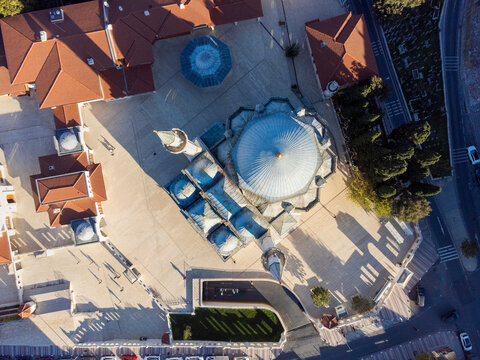 Top down aerial view of the historic Zal Mahmut Pasha Mosque showcasing classical Ottoman architecture and long shadows, Istanbul.
