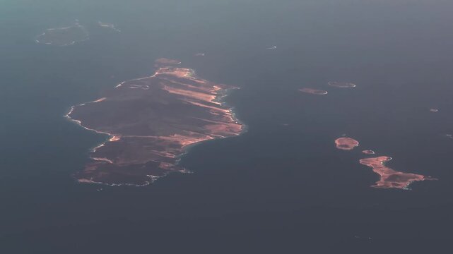flight along Al Mamalih and Jazirat al Hanish al Kabir, also known as Greater Hanish Island, an island in the Red Sea, belonging to Yemen, part of the Hanish Islands group, 4k aerial video footage