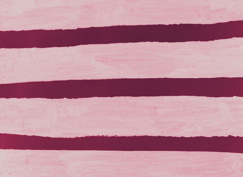 Abstract background with hand drawn horizontal maroon paint brush strokes over pastel pink texture background.