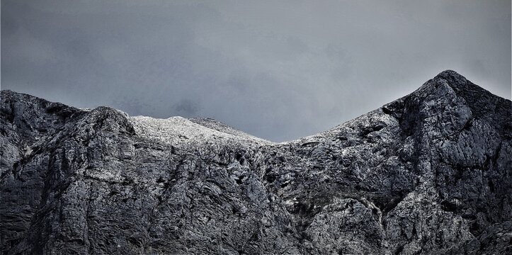 Big mountain with high peak with snow and clouds above, mountain magnificent landscape