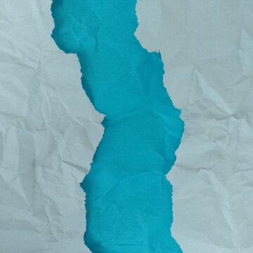 Crumpled blue and light blue paper background. Torn edges. Textured website background. Postcard packaging.
