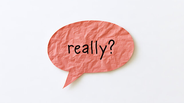 A crumpled pink speech bubble cut out of paper with the text really written in black ink on a clean white background for design ideas