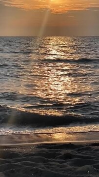 Cinematic golden hour ocean waves splashing on shore, abstract nature background copy space.