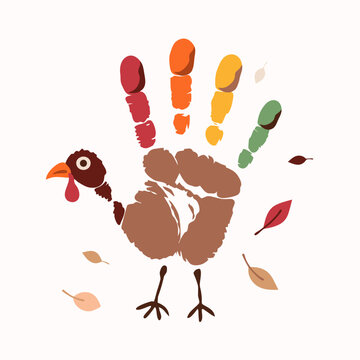 Handprint turkey craft painted by a child with autumn leaves