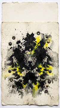 Symmetric ink blot painting on textured off-white paper with black and yellow watercolor splashes and embedded metal eyelet grommets