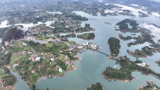 El Pe&ntilde;&oacute;n de Guatap&eacute; Rising Above Guatap&eacute; Reservoir in Antioquia, Colombia. Establishing Shot. Aerial View.