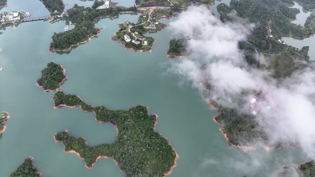 Scenic Guatap&eacute; Lake and Green Islands Surrounded by Mountains in Antioquia, Colombia. Establishing Shot. Aerial View.