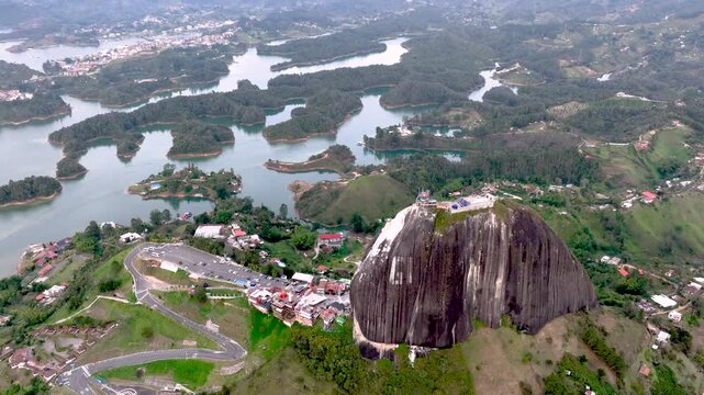 Aerial Panorama of Guatap&eacute; Reservoir and El Pe&ntilde;&oacute;n Surrounded by Islands and Mountains in Colombia. Establishing Shot.