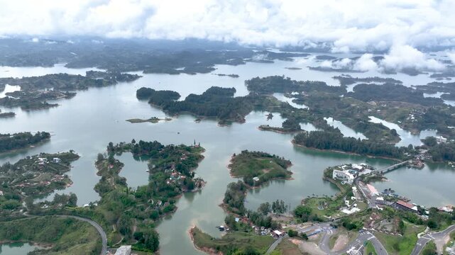 Aerial Panorama of Guatap&eacute; Reservoir and El Pe&ntilde;&oacute;n Surrounded by Islands and Mountains in Colombia. Establishing Shot.
