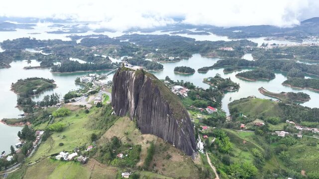 Guatap&eacute; Tourism Landscape with Piedra del Pe&ntilde;ol, Reservoir and Scenic Islands in Antioquia, Colombia. Establishing Shot. Aerial View.