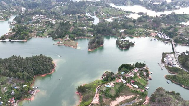 Guatap&eacute; Tourism Landscape with Piedra del Pe&ntilde;ol, Reservoir and Scenic Islands in Antioquia, Colombia. Establishing Shot. Aerial View.