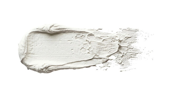 Thick white cosmetic clay or acrylic paint smear with textured strokes on transparent background