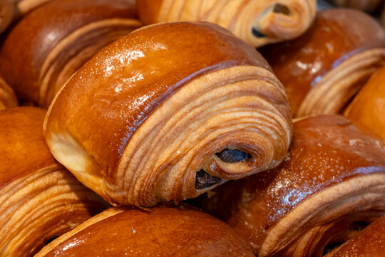 French pastry roll pain au chocolat for traditional breakfast, fresh baked in artinasal bakery in Paris, France