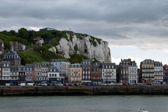 Views of Le Treport, seaside resort in Normandy, France, with white cliffs along  English Channel, fishing industry and old buildings, travel destination in France