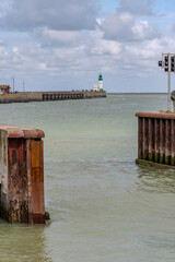 Fototapeta premium Views of Le Treport, seaside resort in Normandy, France, with white cliffs along English Channel, fishing industry and old buildings, travel destination in France