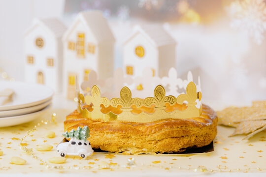 Delicious almond royal galette with crown on the table.