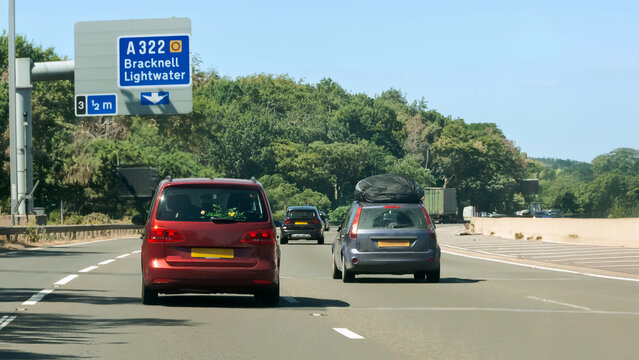 Motorway traffic, A road Signage in England, cars on UK motorway. 