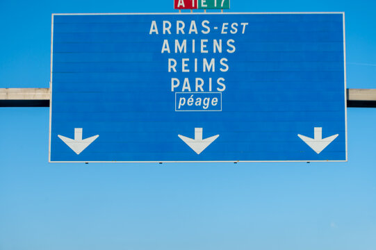 View of a French and European autoroute with overhead directional signs pointing to major cities like Paris, Bordeaux, Lille, Calais, showing lanes, traffic and motorway infrastructure, road signes