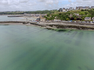 Aerial drone view of underwater oyster farms in Cancale, Brittany, exposed during low tide, raditional sustainable aquaculture and production of premium French oysters, France © barmalini