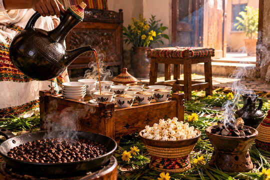 Ethiopian coffee ceremony with jebena pot and incense