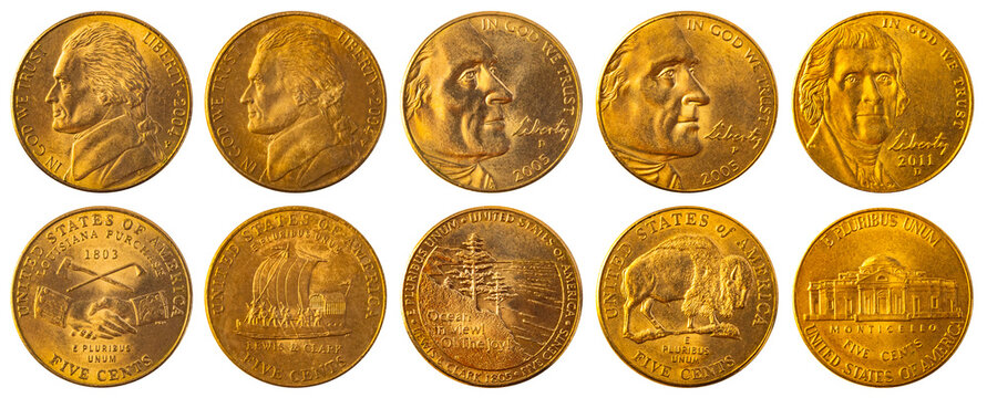 Isolated photo of golden commemorative USA 5 cent 2004, 2005 and 2011 of on white background.