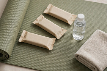 Fototapeta premium Energy Bar Pouches on Yoga Mat Mockup