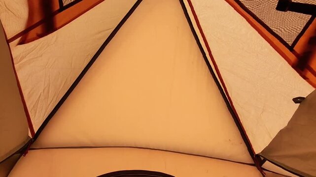 Underside of a Warm Orange Parasol with Curved Support Ribs