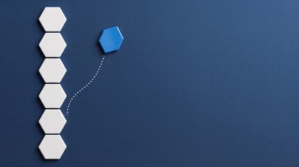Fototapeta premium Conceptual Business Metaphor Showing One Blue Hexagon Breaking Away from a Row of White Hexagons Representing Individuality, Leadership, Innovation, Changing Career Direction and Progress.