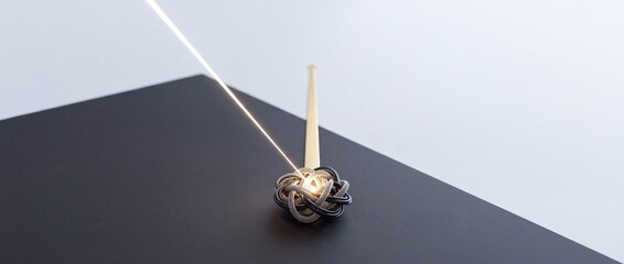 Fototapeta premium Abstract conceptual image of a glowing beam of light hitting a tangled knot on a dark background, symbolizing focus, untangling complexity, and finding a solution in a bulk problem.