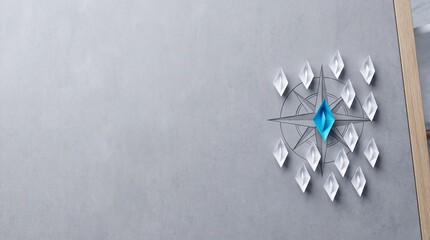 Fototapeta premium Conceptual image of a unique blue origami paper boat leading white boats on a compass rose symbol, representing leadership, vision, and business direction with ample negative space on the left