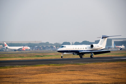 Tangerang, Indonesia - August 25, 2026: Gulfstream G450 private jet lands on the runway at Soekarno-Hatta International Airport.