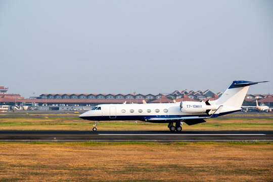 Tangerang, Indonesia - August 25, 2026: Gulfstream G450 private jet lands on the runway at Soekarno-Hatta International Airport.