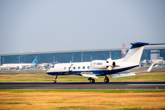 Tangerang, Indonesia - August 25, 2026: Gulfstream G450 private jet lands on the runway at Soekarno-Hatta International Airport.