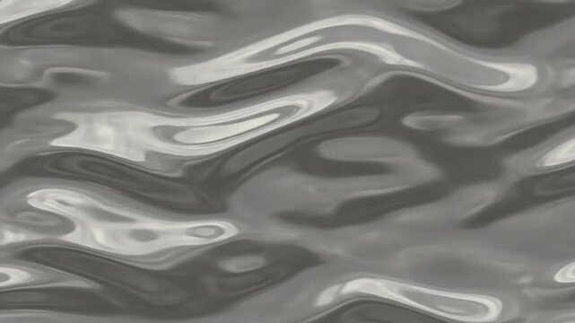 Wavy reflective gray surface with undulating ridges and highlights