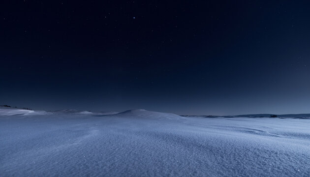 Starry Night Sky Over Quiet Winter Snowfield