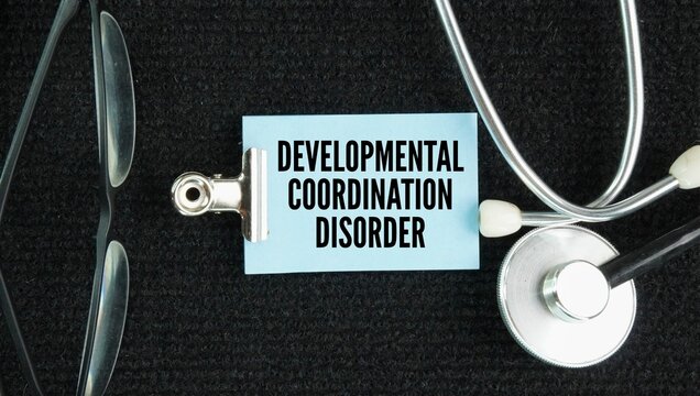 Stethoscope and paper with words Developmental coordination disorder DCD, also known as dyspraxia, is a lifelong neurodevelopmental condition that affects how the brain plans and coordinates physical 