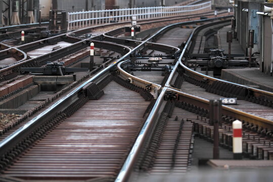 Railroad tracks converging and diverging at a complex junction