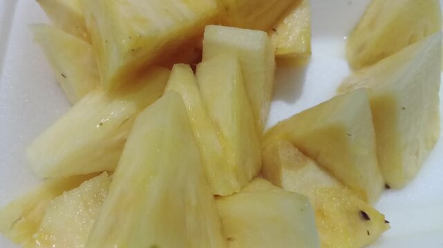 Video of sliced pineapple on a background
