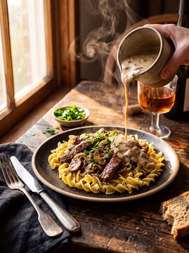 Gourmet Creamy Beef Stroganoff with Rich Sauce Pour at Golden Hour