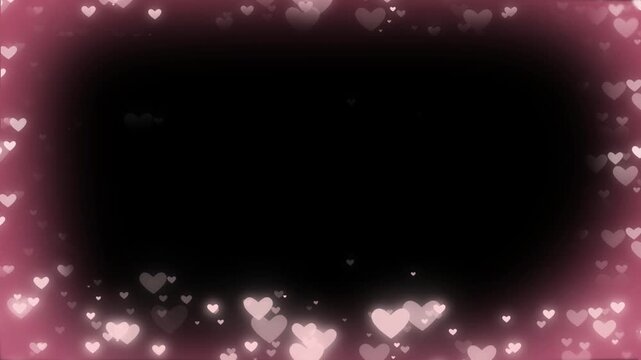 Pink heart bokeh lights create a glowing frame around a dark space.