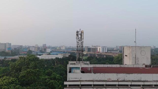 Drone Aerial Footage of Communication Tower and Dense Urban Neighborhood
