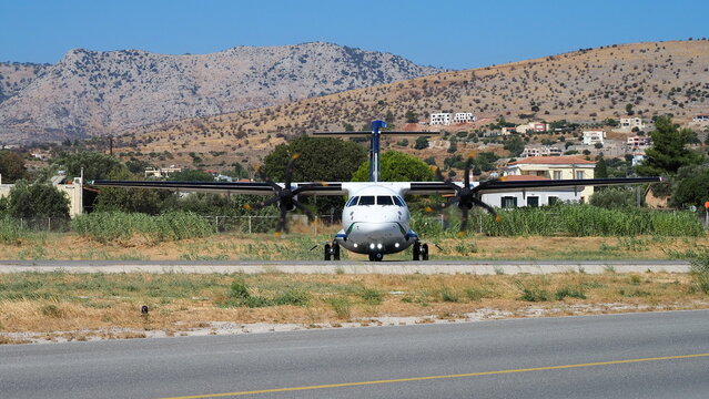 ATR Turboprop Passenger Aircraft Taxiing on Airport Runway