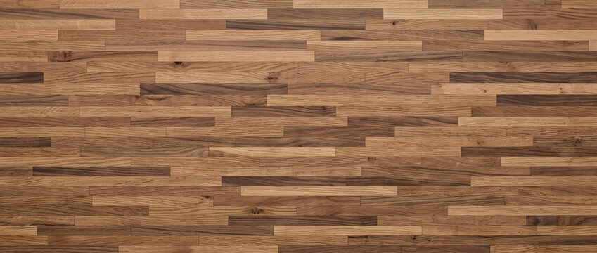 Mixed tone walnut parquet flooring background featuring staggered brick block pattern ideal for interior design projects