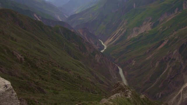 Panning shot of the deep Apurimac Canyon landscape from Capitan Rumi viewpoint in Curahuasi, Peru.