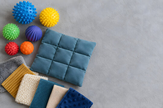Sensory Integration Tools with Textured Balls and Weighted Pad Flat Lay

