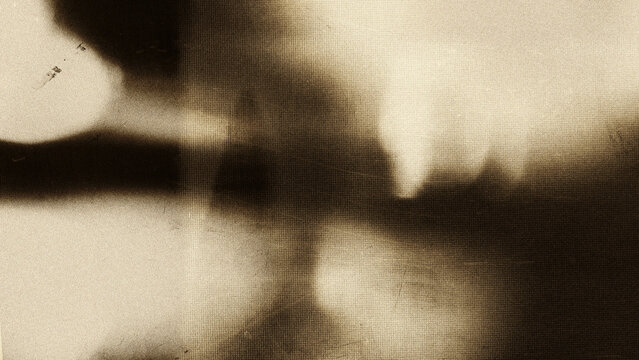 Cinematic film grain texture with soft light leaks, vintage analog photography aesthetic on dark background, subtle noise overlay for retro video editing, filmmaking, nostalgic visuals