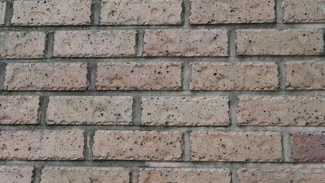 Beige brick wall texture with horizontal masonry pattern